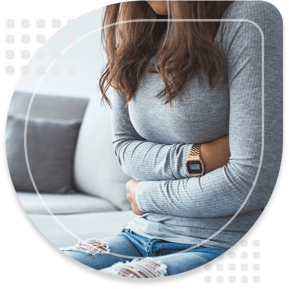 Woman lying on sofa looking sick in the living room