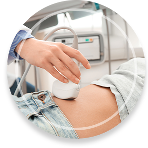 Woman undergoing ultrasound scan in clinic