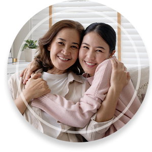 Attractive beautiful mum sit at cozy sofa couch living room in family moment grown up child kid look camera celebrate joy good warm time relationship with retired overjoy lady girl life insurance.