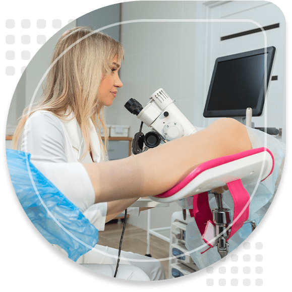 A gynecologist performs a colposcopy on a young girl in a gynecological chair in a modern medical office. Prevention and diagnosis of cervical cancer