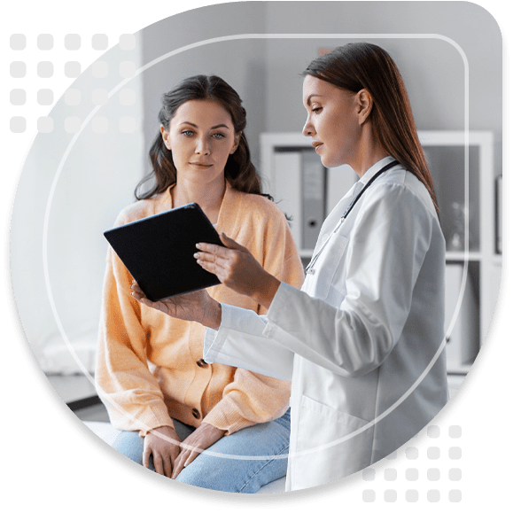 medicine, healthcare and people concept - female doctor with tablet pc computer talking to woman patient at hospital